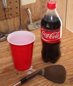 Rusty wedge, Cup, and Coke bottle