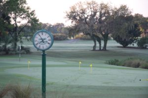 Putting green and clock near the first tee
