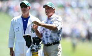 Caddie Joe LaCava discusses a shot with Fred Couples at the 2011 Masters Tournament