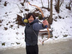 Hannah Yun with bow and arrow